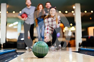 Friends enjoying bowling at club