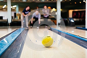 Friends enjoying bowling at club