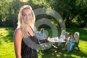 Friends enjoying garden party on a sunny afternoon