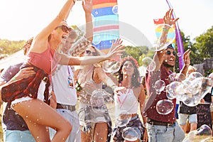 Friends enjoying a performance at a music festival photo