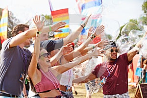 Friends enjoying a performance at a music festival