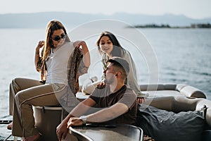 Friends enjoying a relaxing boat trip on a serene lake on a sunny day