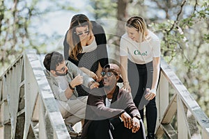 Friends enjoying a sunny day together outdoors in a park, sharing moments of fun and joy