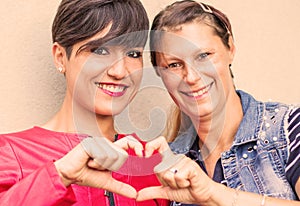 friends exchange cuddles and signs of affection  smiling