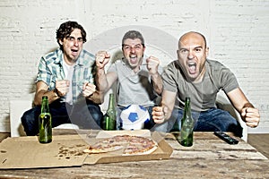 Friends fanatic football fans watching game on tv celebrating goal screaming crazy happy