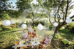 Friends during a festive lunch in the garden