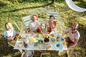 Friends during a festive lunch in the garden