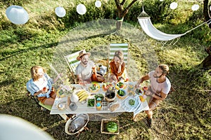 Friends during a festive lunch in the garden