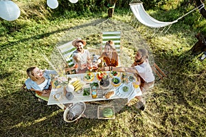 Friends during a festive lunch in the garden