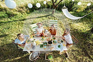 Friends during a festive lunch in the garden