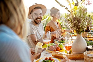 Friends during a festive lunch in the garden