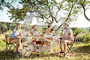 Friends during a festive lunch in the garden