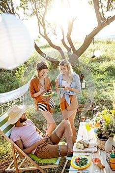 Friends during a festive lunch in the garden