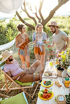 Friends during a festive lunch in the garden