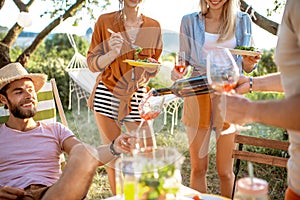 Friends during a festive lunch in the garden