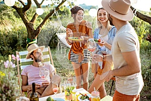 Friends during a festive lunch in the garden