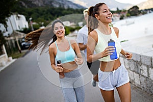 Friends fitness training together outdoors living active healthy