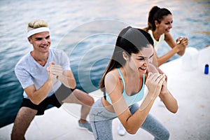 Friends fitness training together outdoors living active healthy