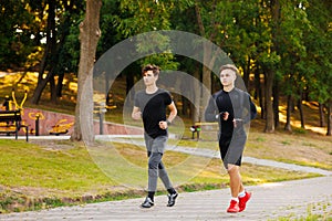 Friends fitness training together outdoors in the morning in park living active healthy. Healthy lifestyle concept.