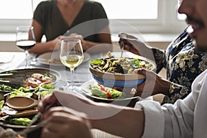 Friends gather having Italian food together