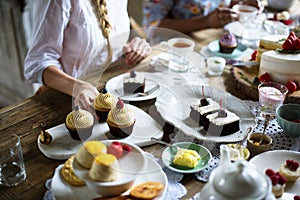 Friends Gathering Together on Tea Party Eating Cakes Enjoyment h