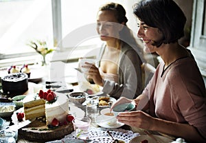 Friends Gathering Together on Tea Party Eating Cakes Enjoyment h