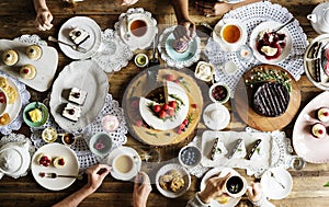 Friends Gathering Together on Tea Party Eating Cakes Enjoyment h