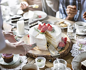 Friends Gathering Together on Tea Party Eating Cakes Enjoyment h