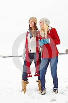 Friends, girl and happy outdoor in snow for memories on holiday, fun and break in Canada. Women, laugh and smile in