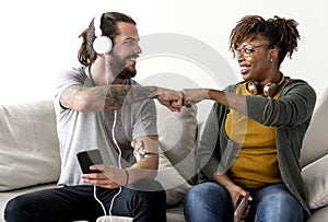 Friends giving fist bumps to each other