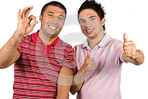 Friends giving okay sign and thumb up