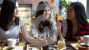 Friends group of Asian female enjoying and having a conversation at cafe and restaurant