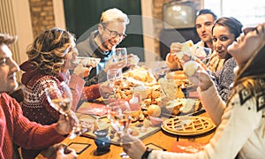 Friends group eating christmas sweets food and having fun at xmas dinner party