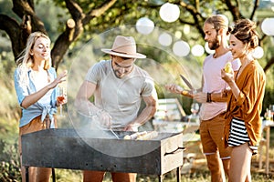 Friends having barbecue in the garden