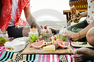 Friends having a beach picnic