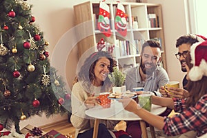 Friends having Christmas morning coffee