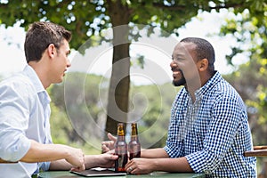 Friends having a conversation while having beer
