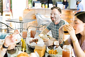 Friends Having Fast Food At Eatery