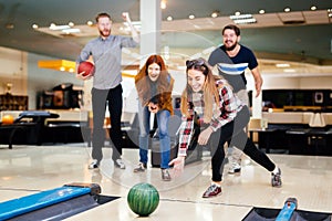 Friends having fun while bowling