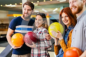 Friends having fun while bowling