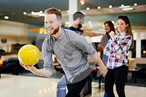 Friends having fun while bowling