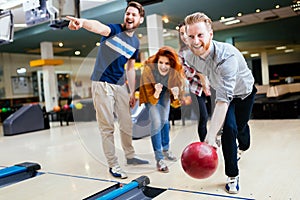 Friends having fun while bowling