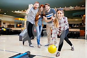 Friends having fun while bowling