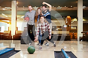 Friends having fun while bowling