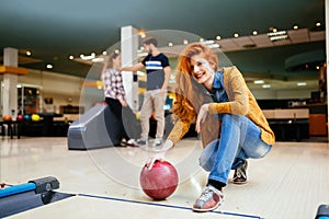 Friends having fun while bowling