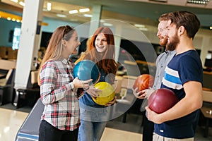 Friends having fun while bowling