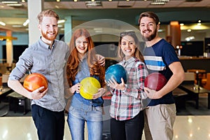 Friends having fun while bowling