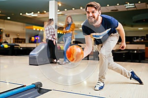 Friends having fun while bowling