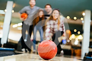 Friends having fun while bowling