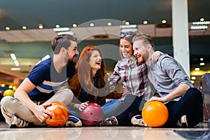 Friends having fun while bowling